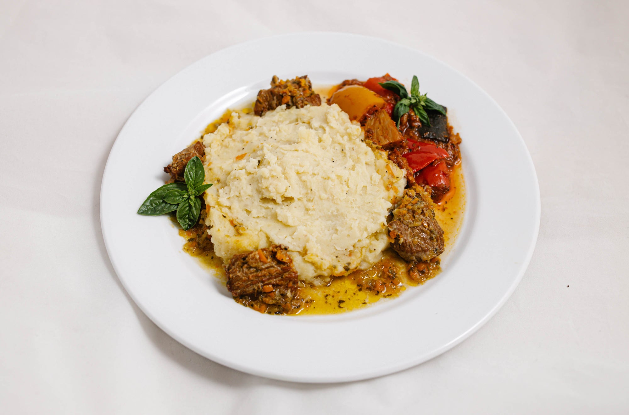 Dish with Baby Beef Spezzatino in a plate