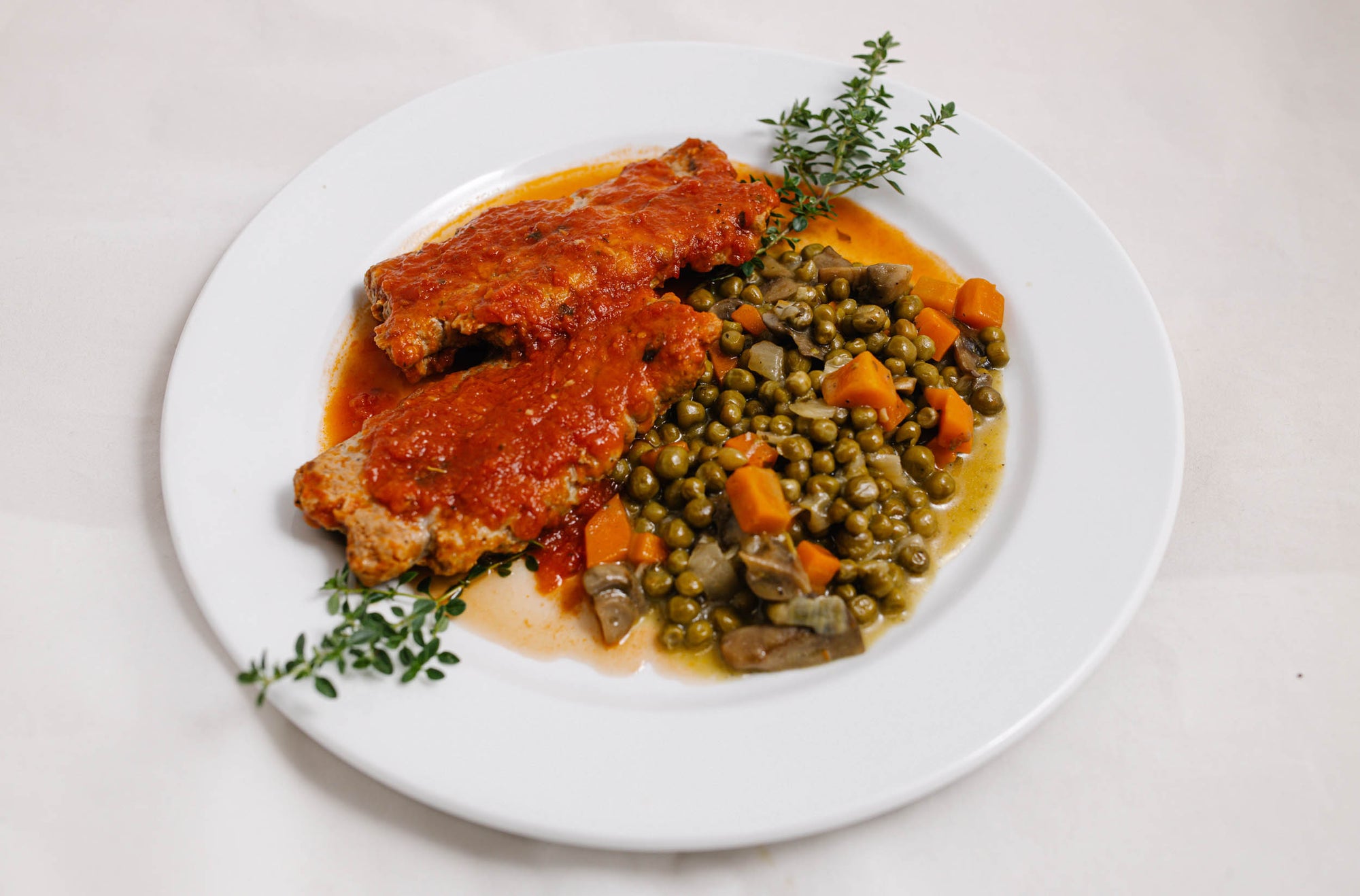 Peas Mushrooms Carrots on a plate
